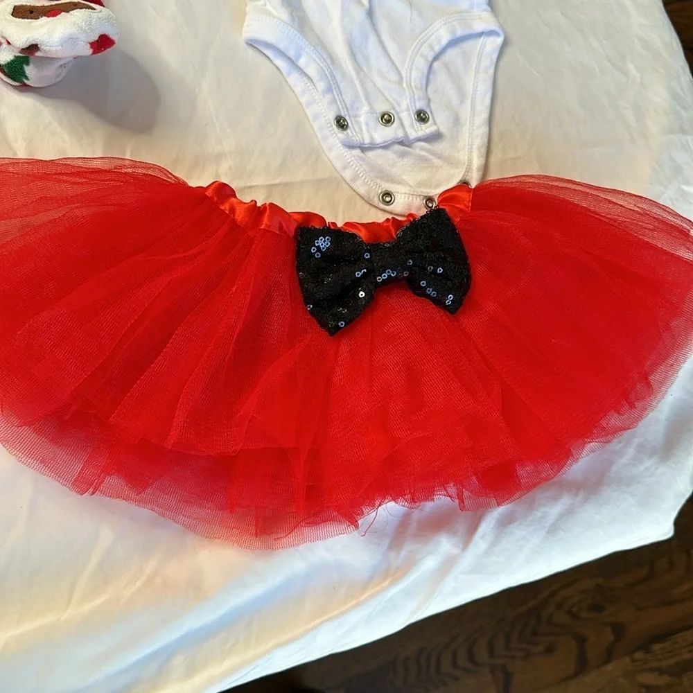 Carter’s baby girl Christmas bundle. One pair of fleece footed pajamas, one tutu